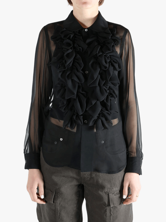 Black shirt  worn by a person, showing the shirt fit