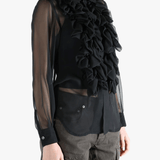 Black shirt  worn by a person, showing the shirt fit