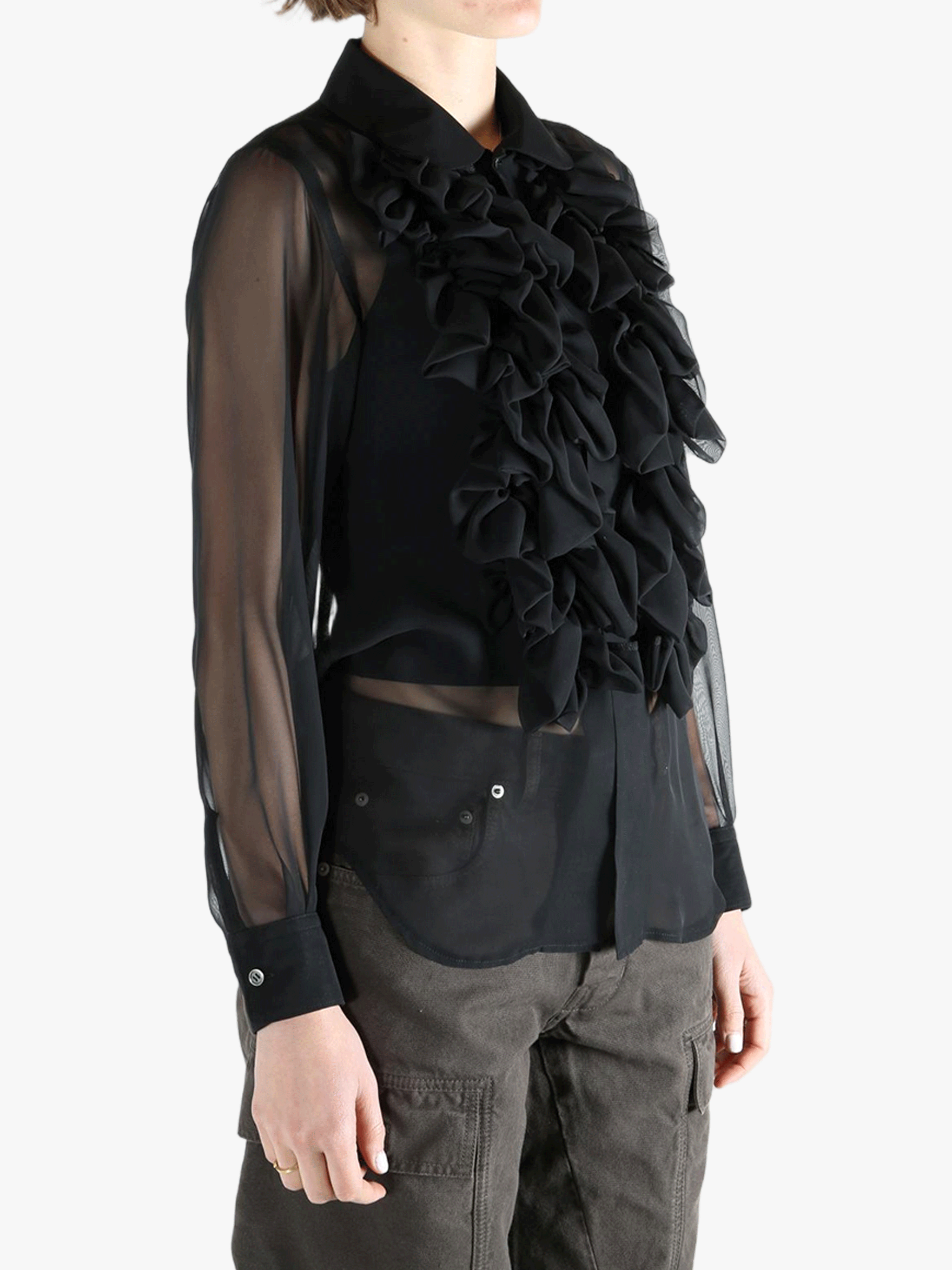 Black shirt  worn by a person, showing the shirt fit