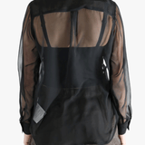 Black shirt  worn by a person, showing the shirt fit