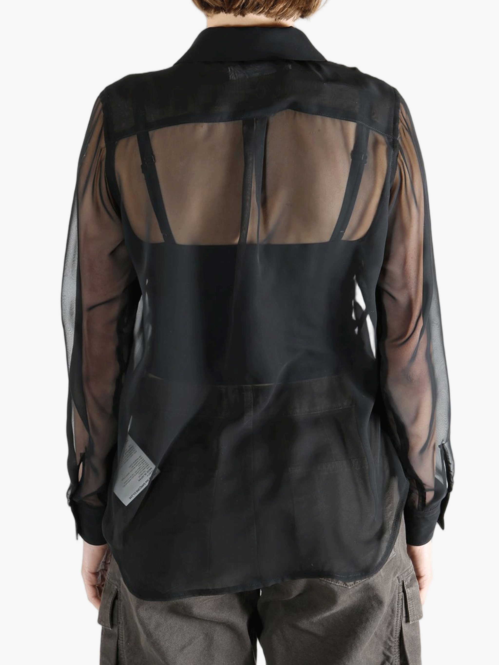 Black shirt  worn by a person, showing the shirt fit