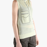 Green tops worn by a person, showing the tops fit