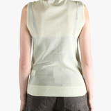 Green tops worn by a person, showing the tops fit