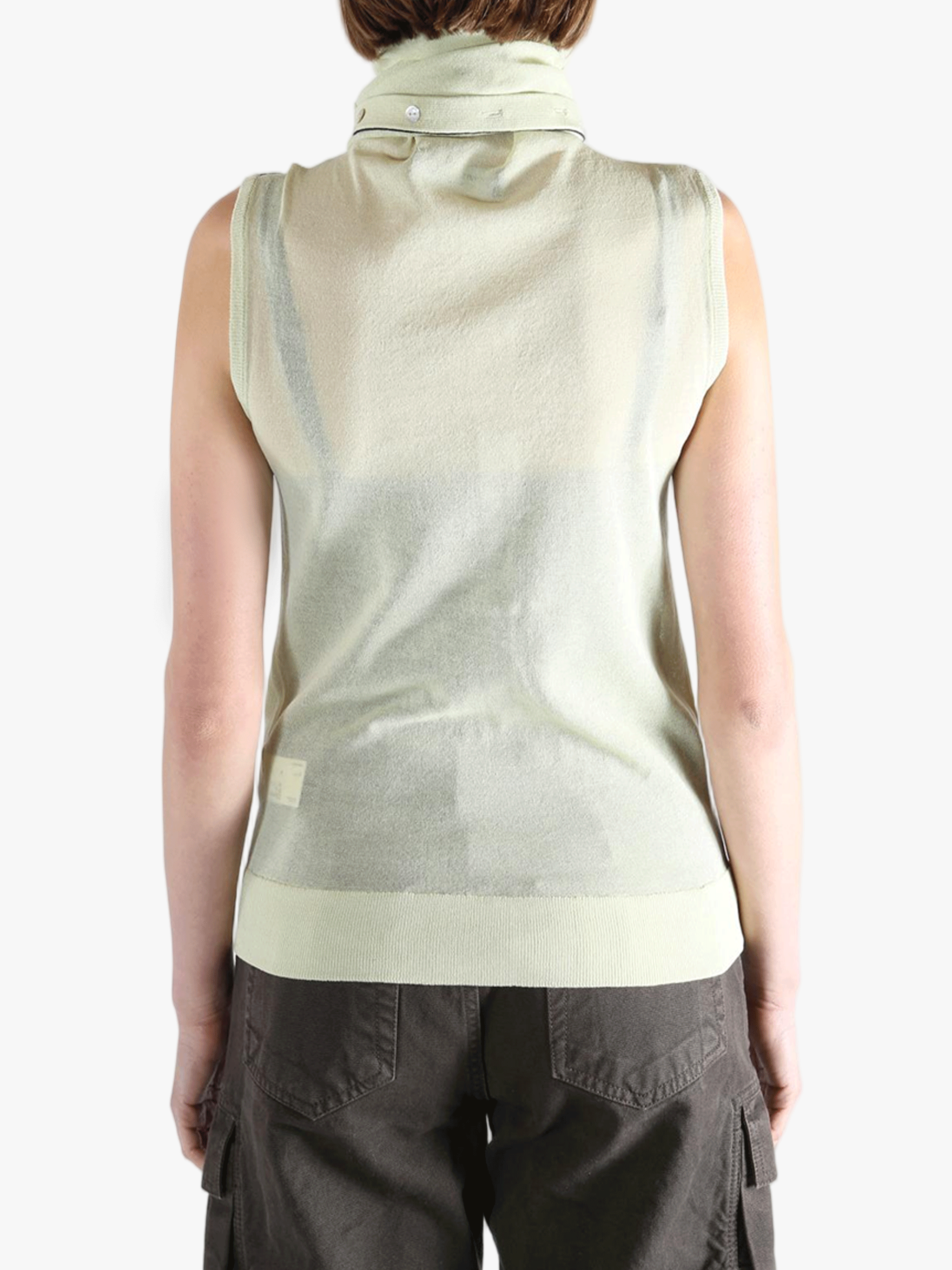 Green tops worn by a person, showing the tops fit