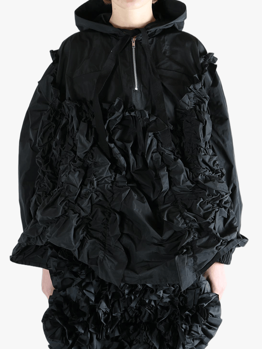 Black jacket  worn by a person, showing the jacket  fit