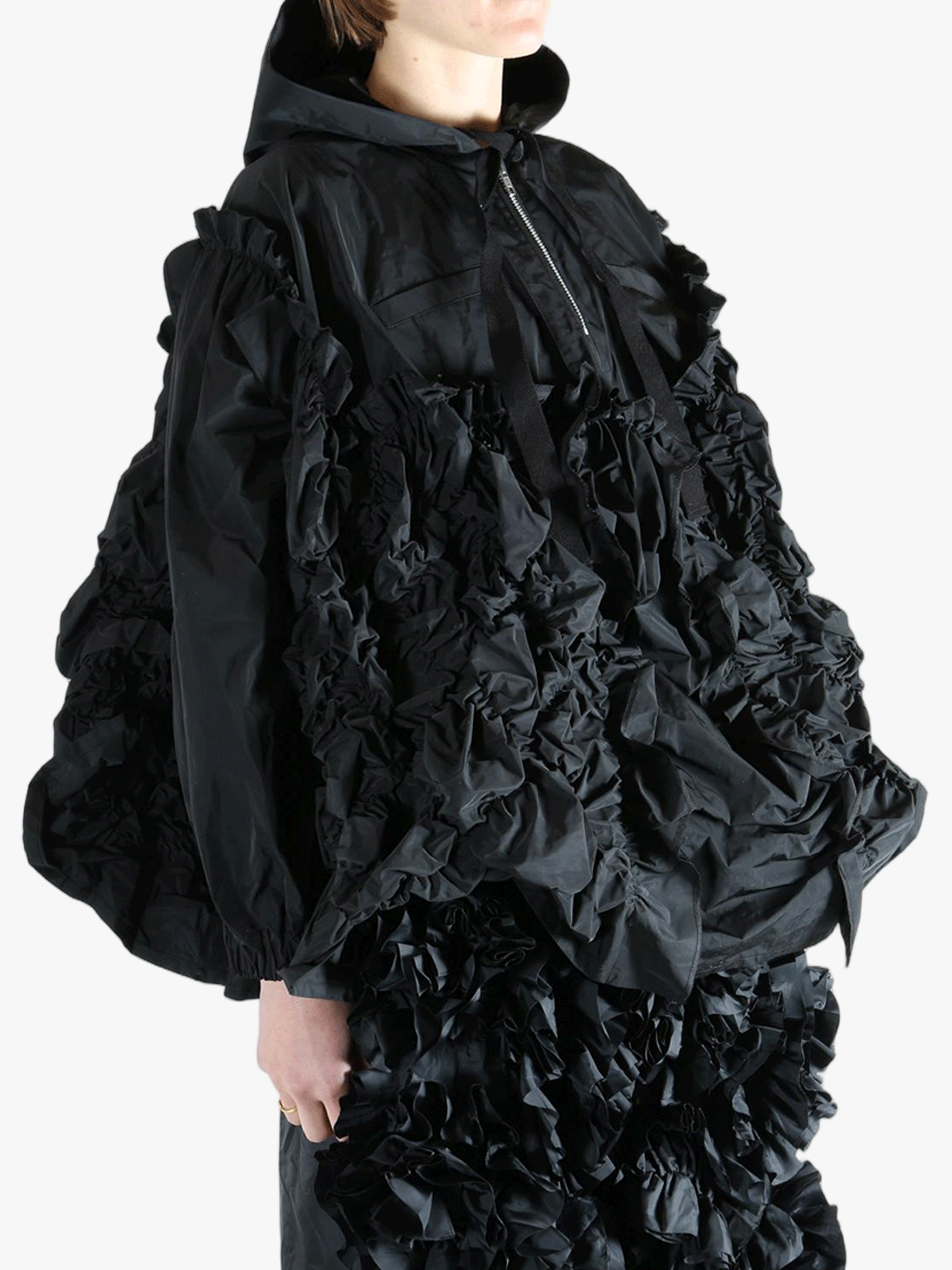 Black jacket  worn by a person, showing the jacket  fit