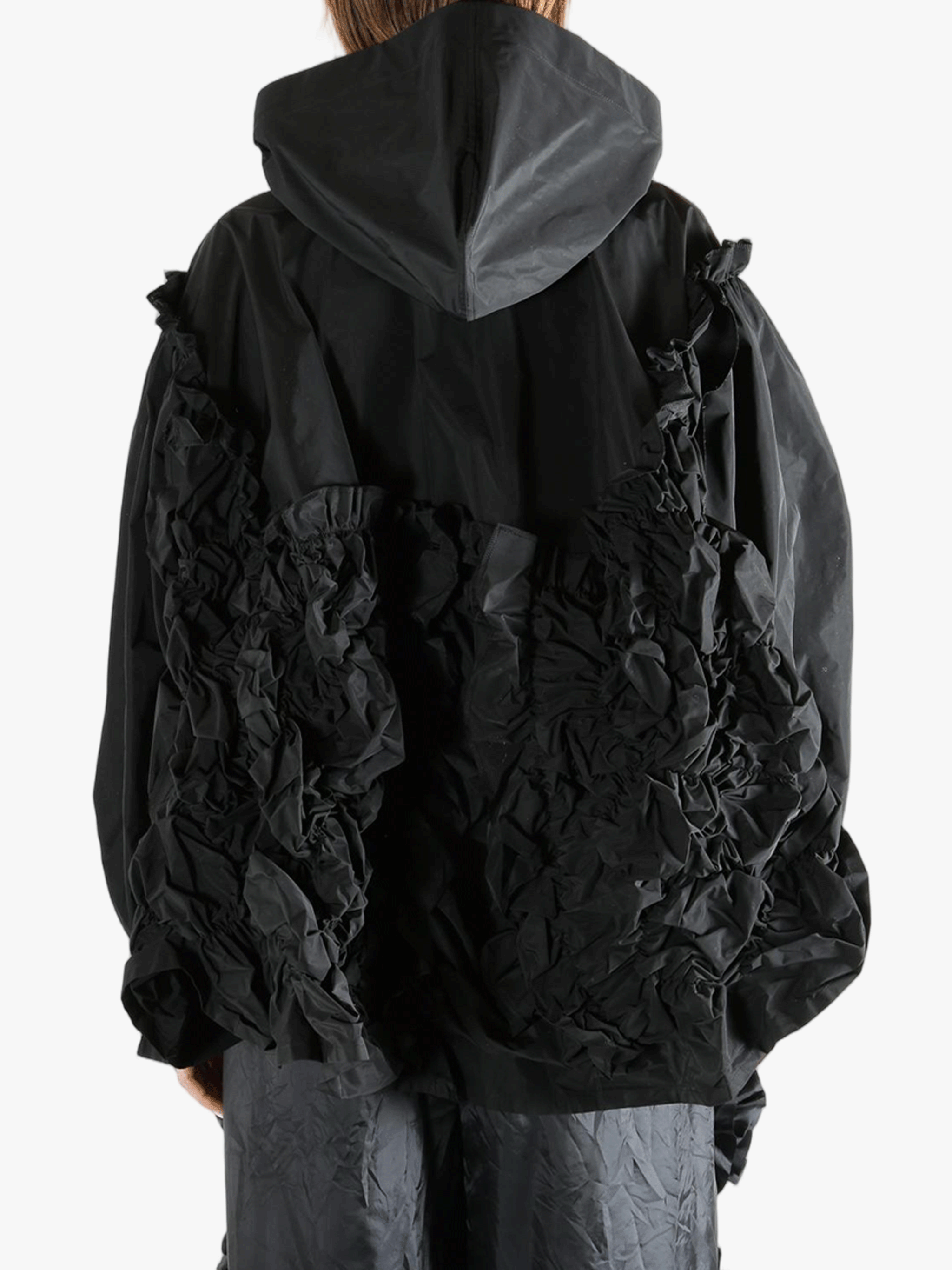 Black jacket  worn by a person, showing the jacket  fit