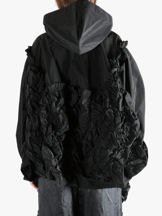 Black jacket  worn by a person, showing the jacket  fit