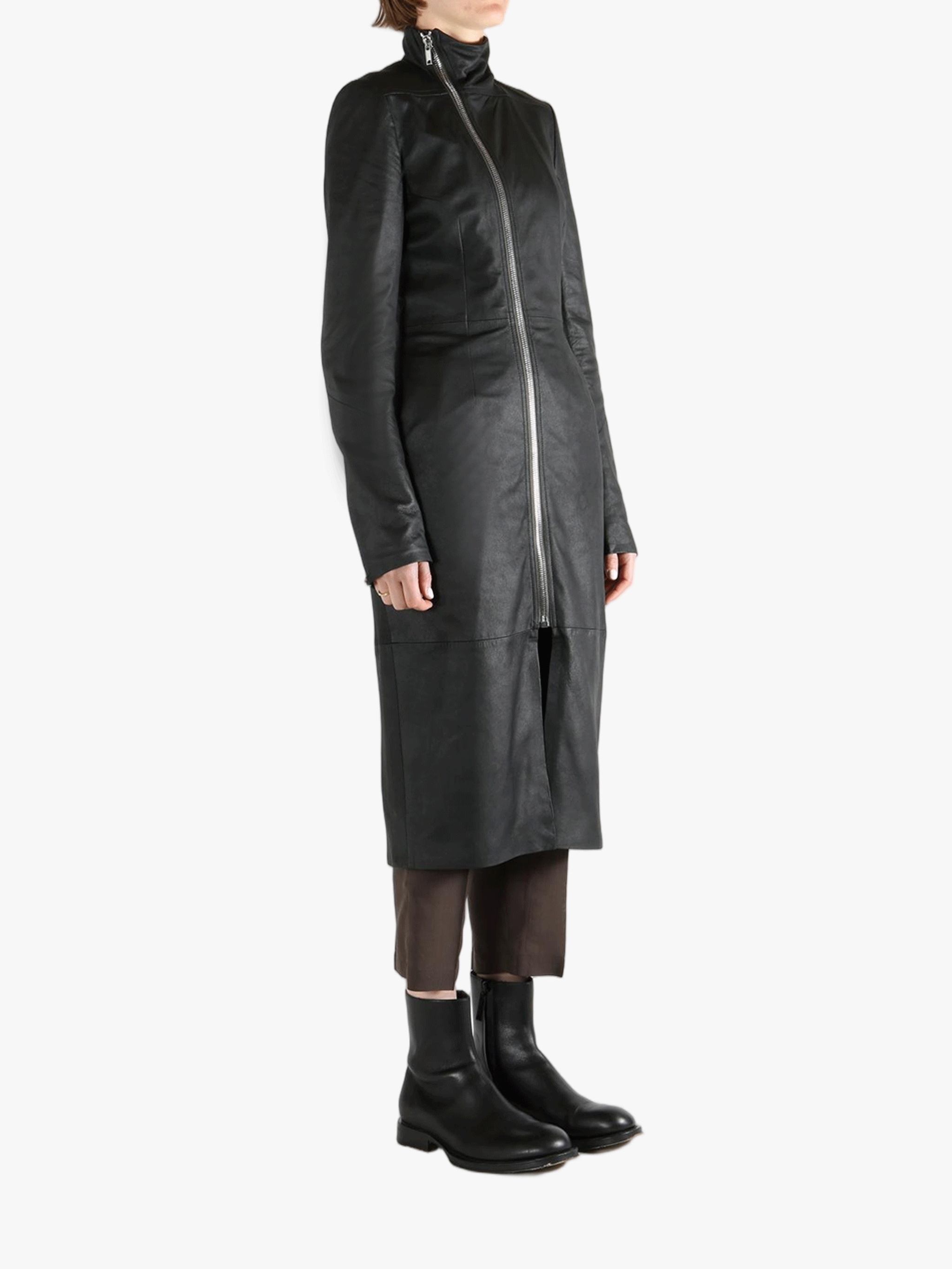 Black coat worn by a person, showing the coat fit