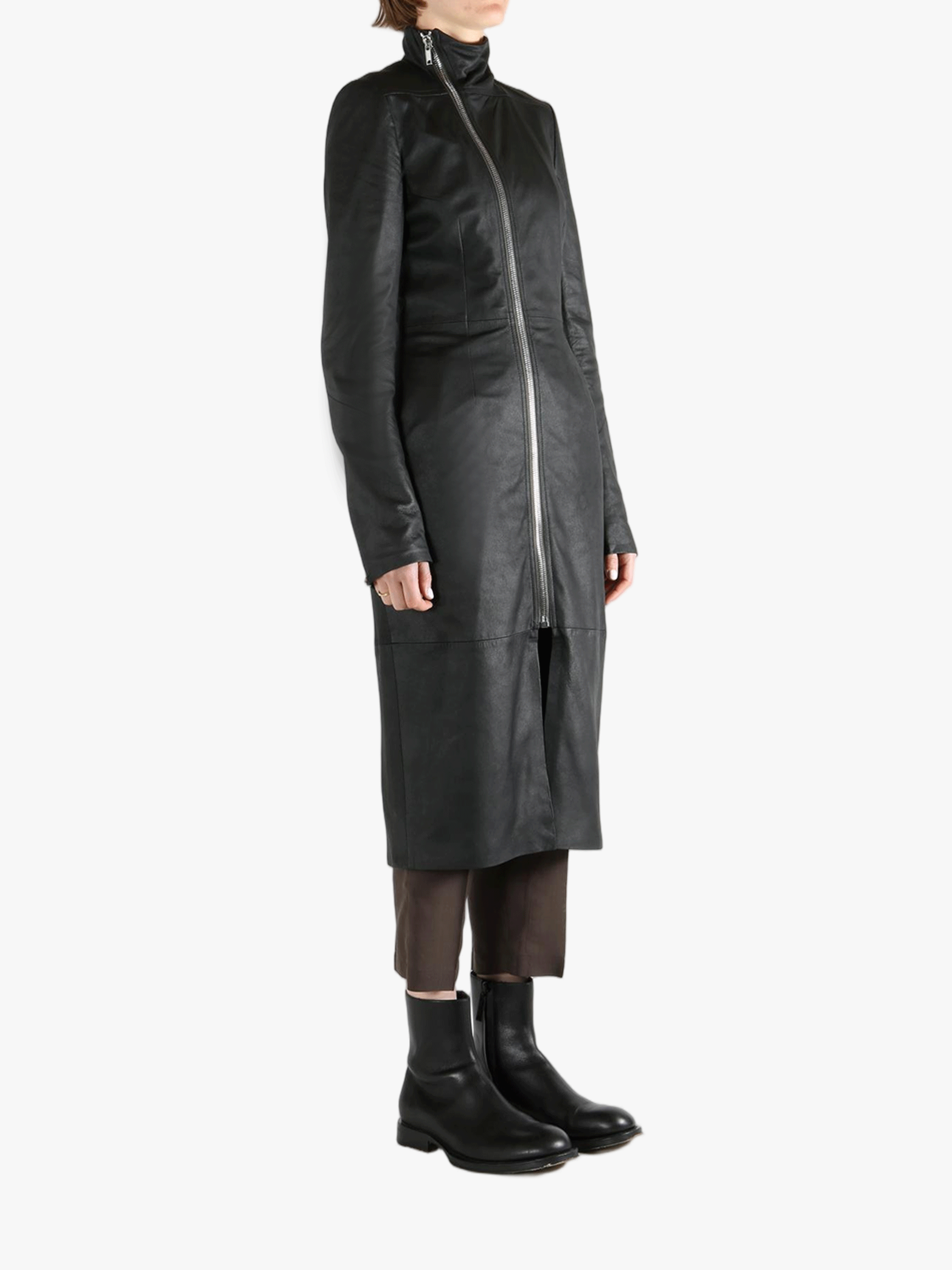 Black coat worn by a person, showing the coat fit