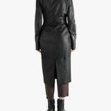 Black coat worn by a person, showing the coat fit