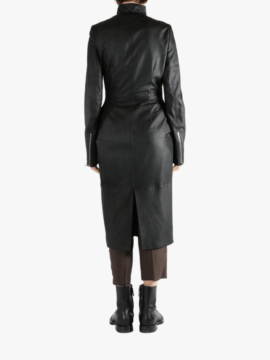 Black coat worn by a person, showing the coat fit