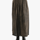 Brown pants  worn by a person, showing the pants fit