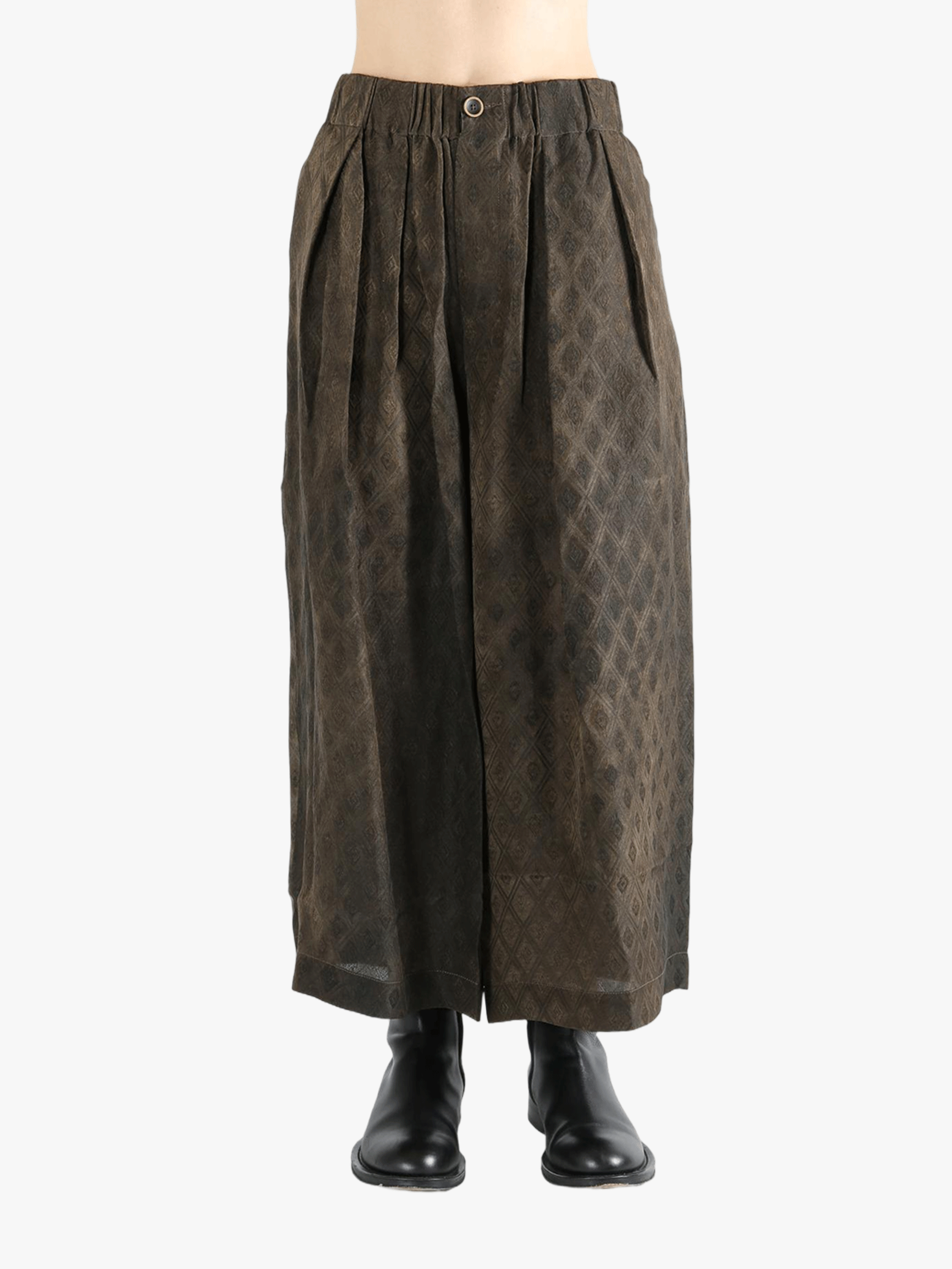 Brown pants  worn by a person, showing the pants fit