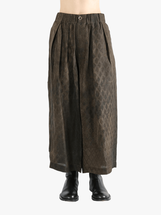 Brown pants  worn by a person, showing the pants fit