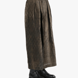 Brown pants  worn by a person, showing the pants fit