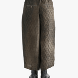 Brown pants  worn by a person, showing the pants fit