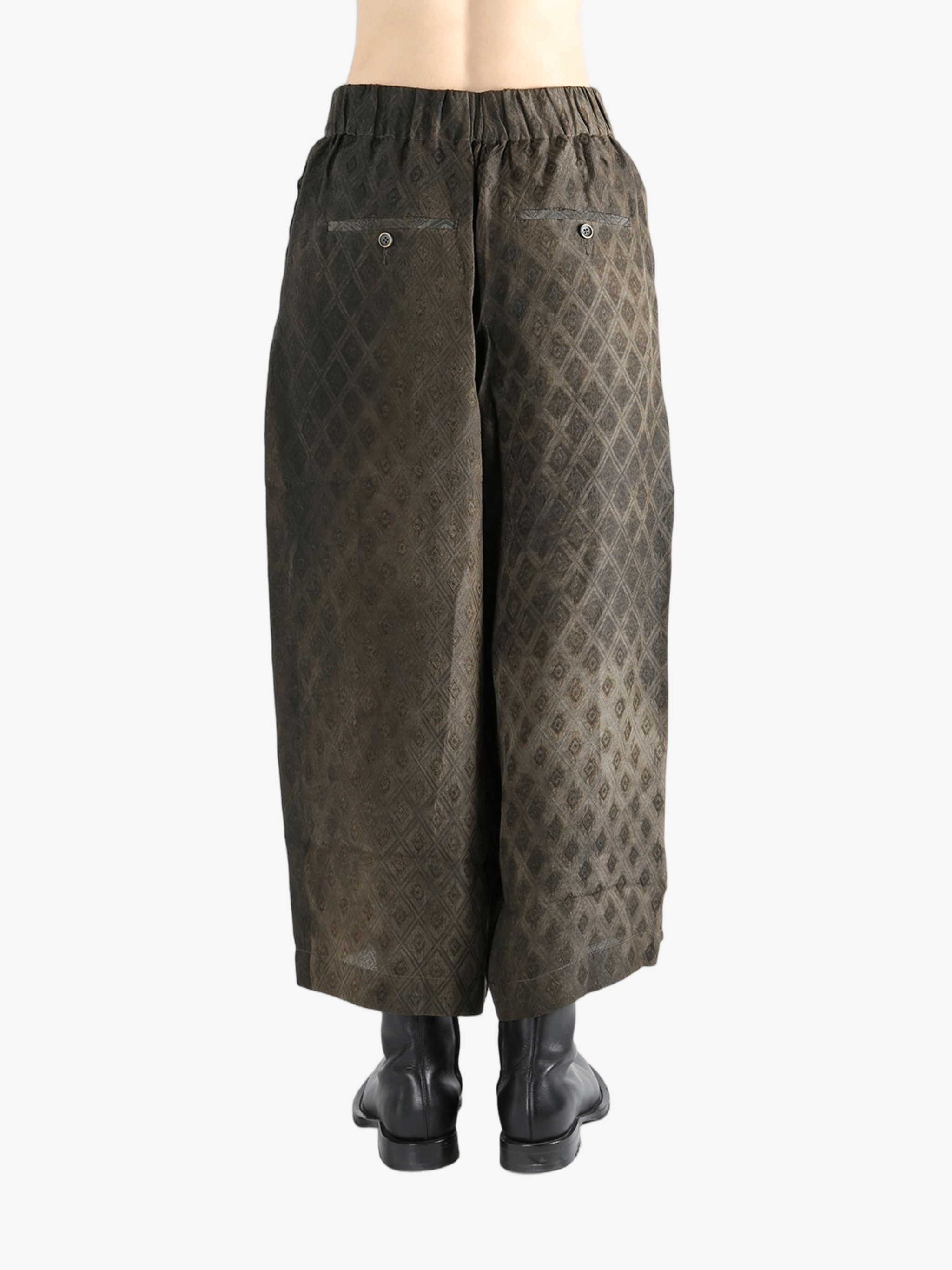 Brown pants  worn by a person, showing the pants fit