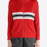 Red knitwear worn by a person, showing the knitwear fit