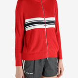 Red knitwear worn by a person, showing the knitwear fit