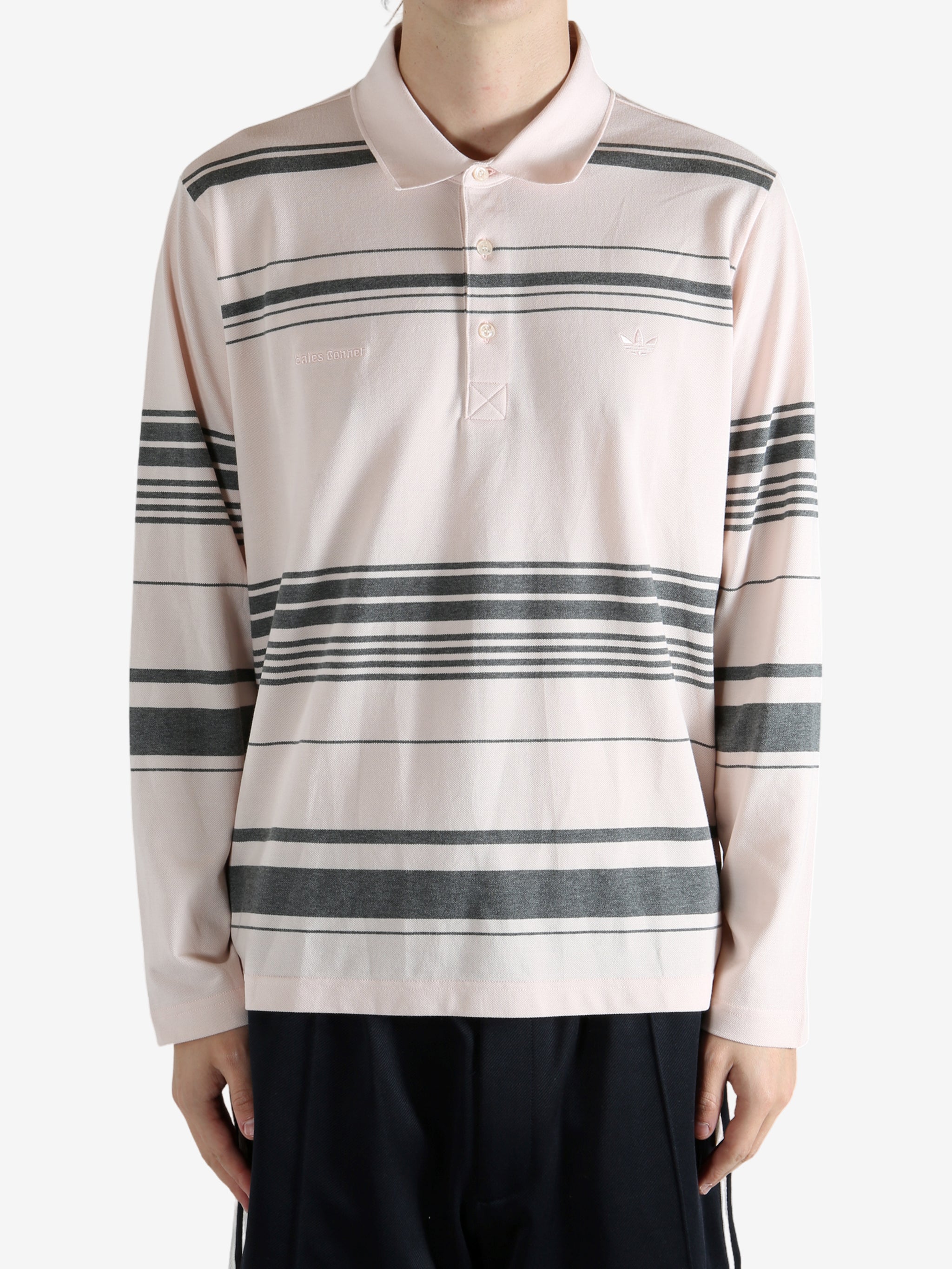 Pink shirt worn by a person, showing the shirt fit