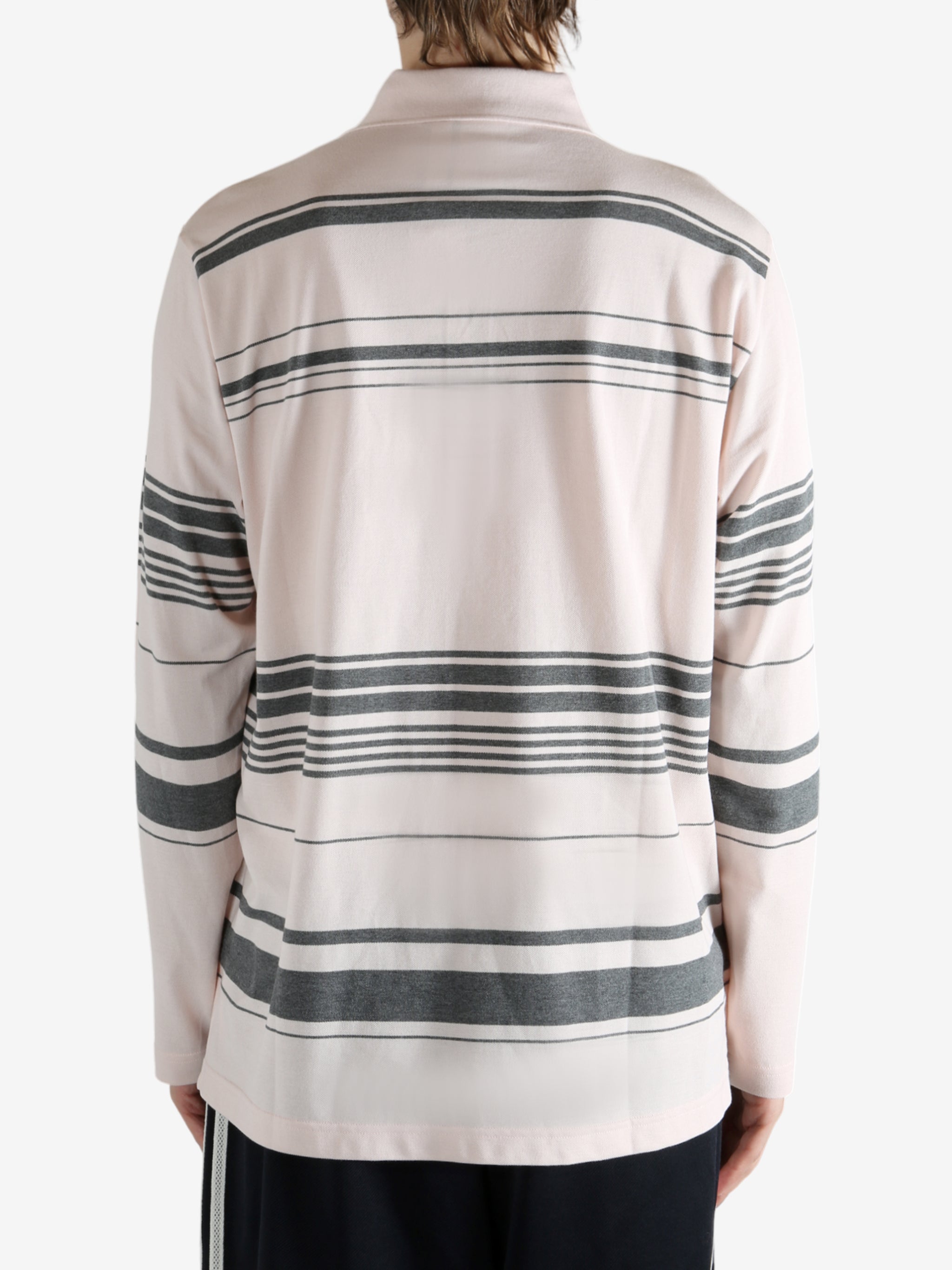 Pink shirt worn by a person, showing the shirt fit