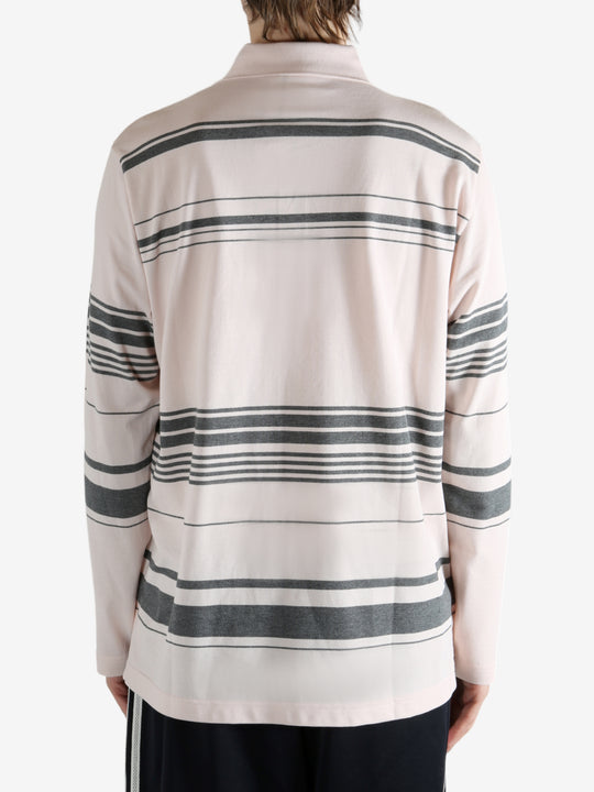 Pink shirt worn by a person, showing the shirt fit