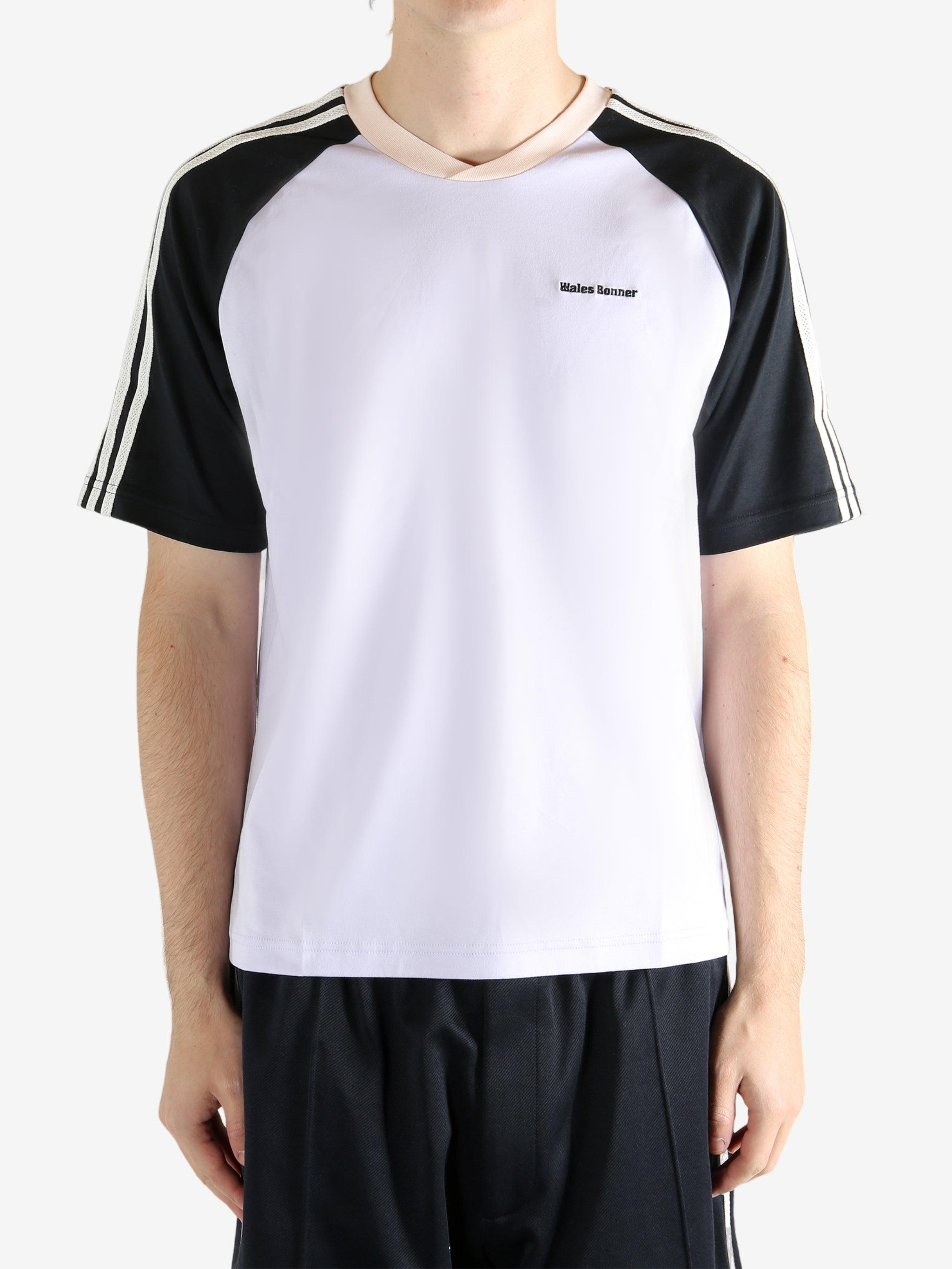 White t-shirt worn by a person, showing the t-shirt fit