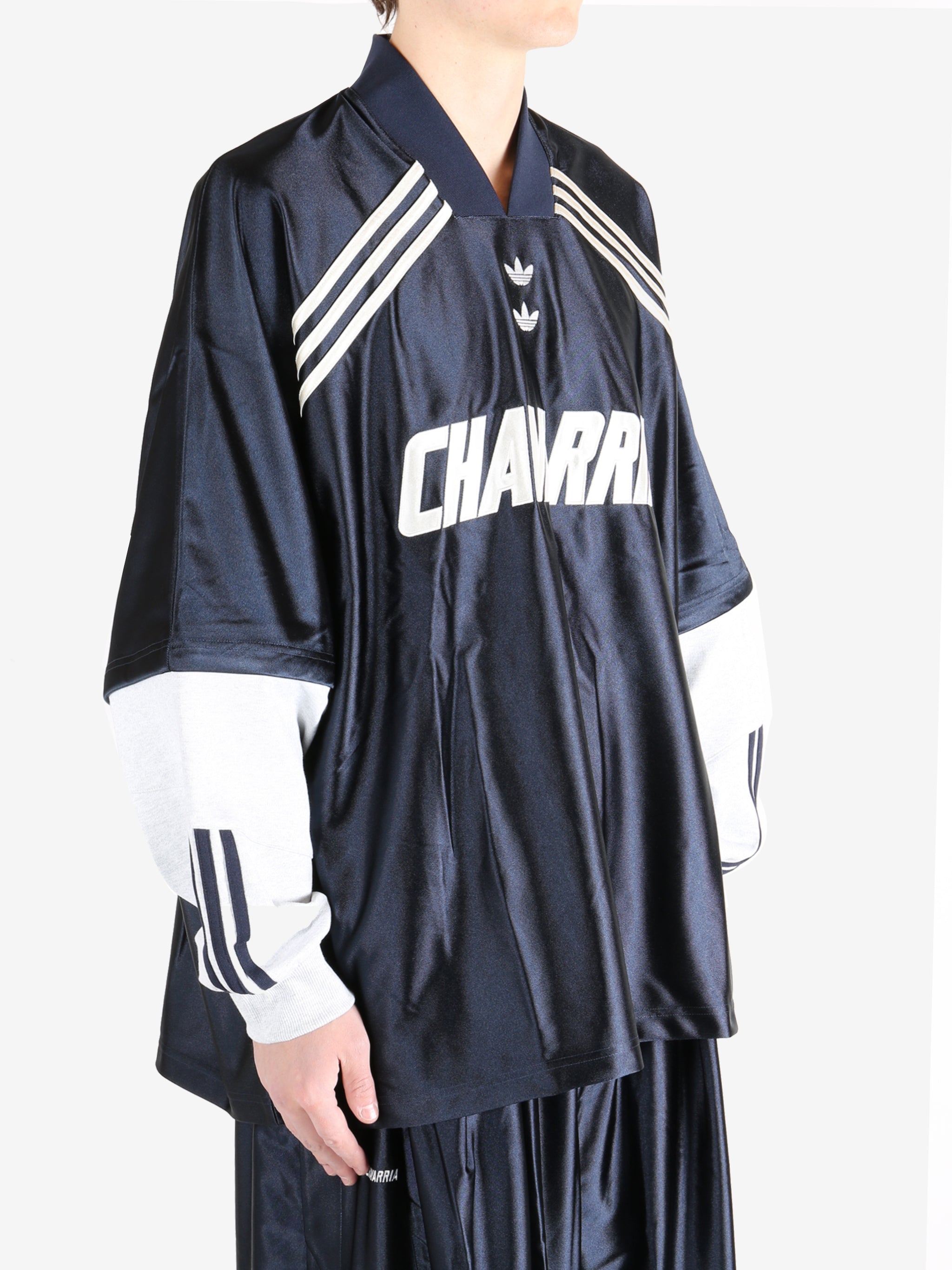 Navy top worn by a person, showing the  top fit