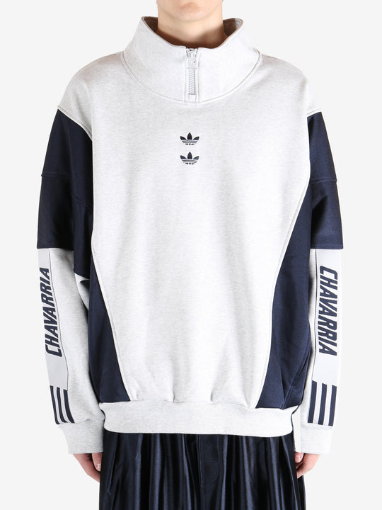 White tops by a person, showing the  tops fit