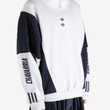 White tops by a person, showing the  tops fit