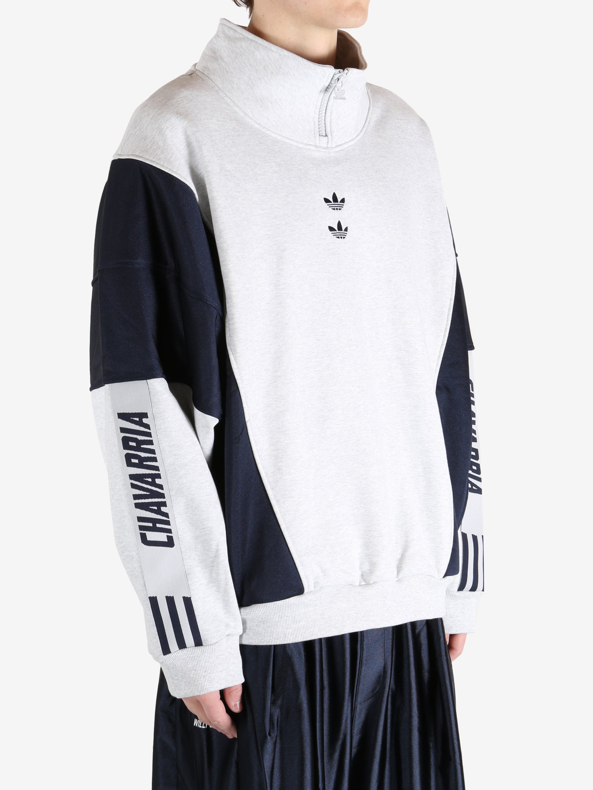 White tops by a person, showing the  tops fit