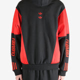 Black coat worn by a person, showing the coat's fit