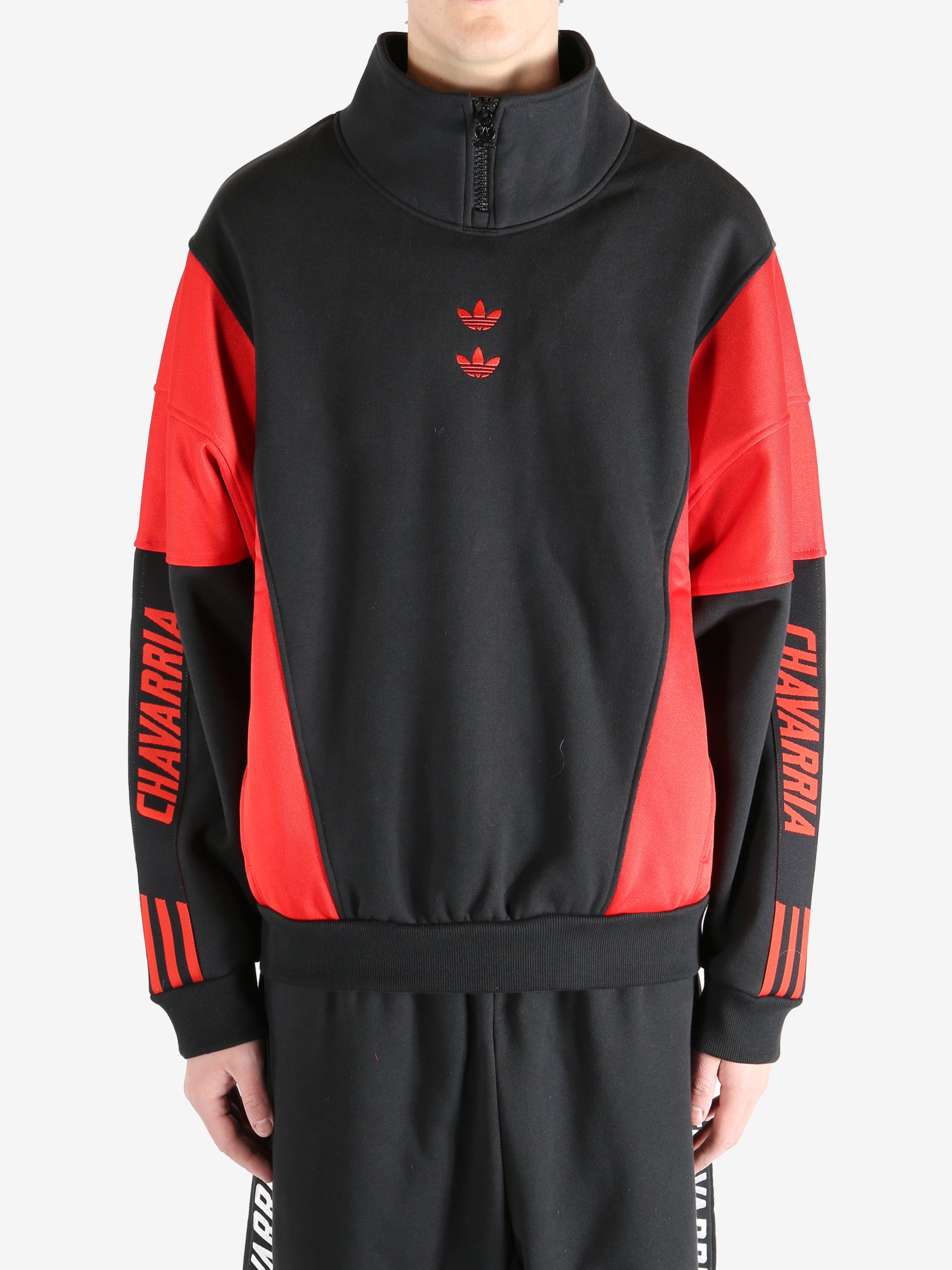 Black coat worn by a person, showing the coat's fit