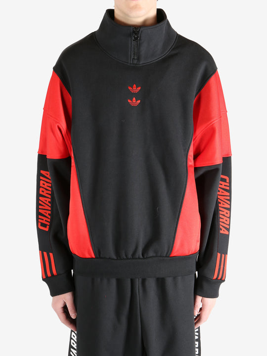 Black coat worn by a person, showing the coat's fit