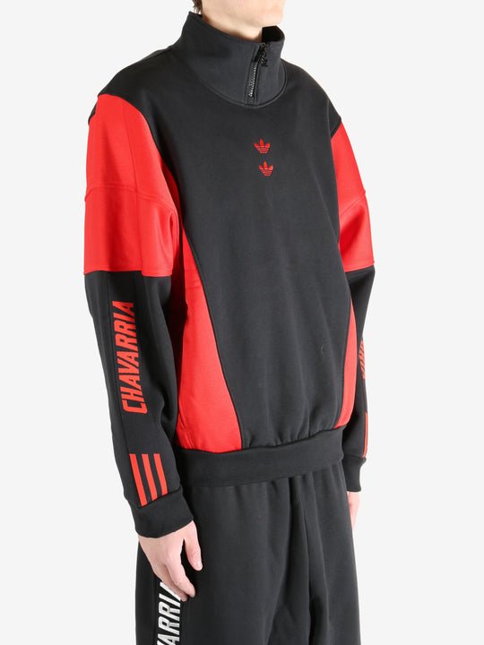 Black coat worn by a person, showing the coat's fit