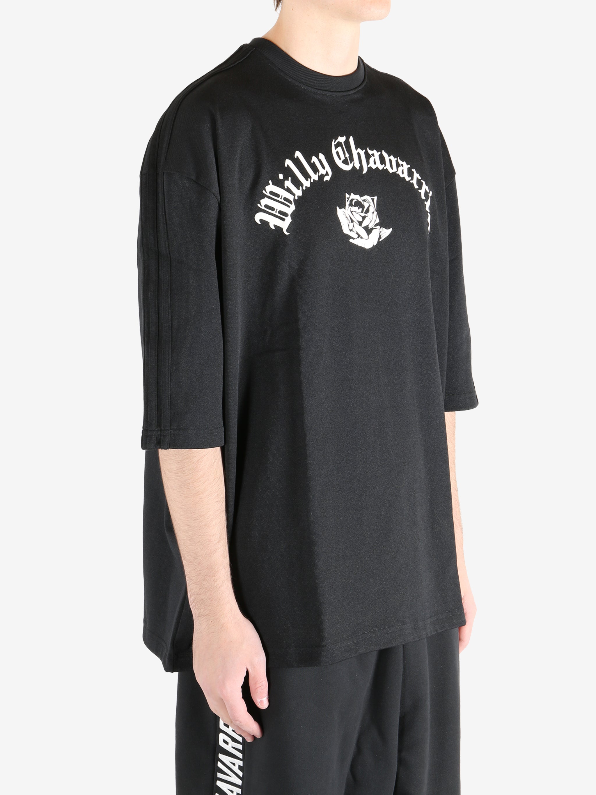 Black shirts worn by a person, showing the shirts fit