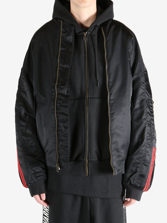 Black jacket worn by a person, showing the jacket's fit