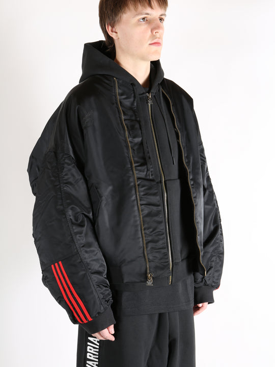 Black jacket worn by a person, showing the jacket's fit