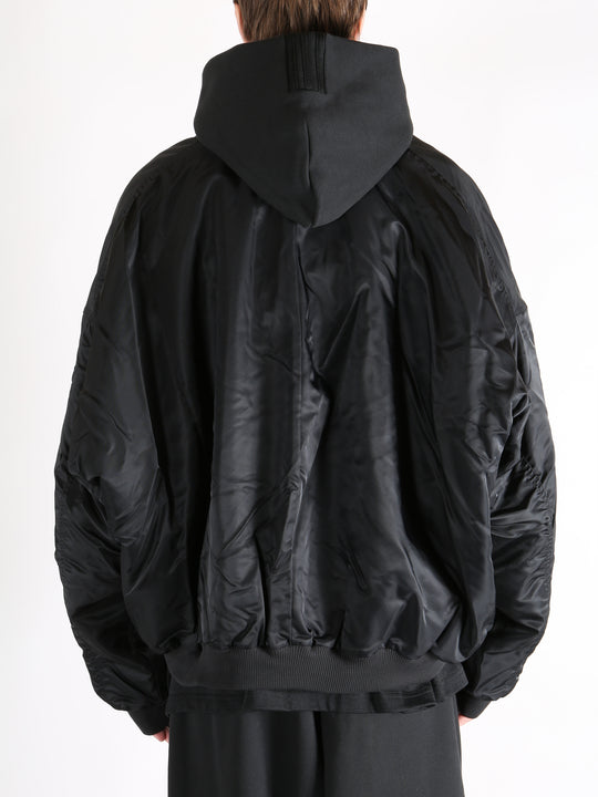 Black jacket worn by a person, showing the jacket's fit