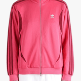 Red top worn by a person, showing the top fit