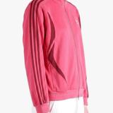 Red top worn by a person, showing the top fit