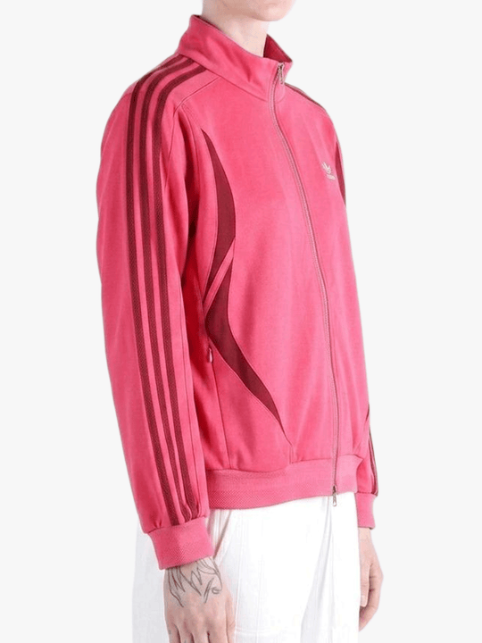 Red top worn by a person, showing the top fit