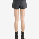 Black shorts worn by a person, showing the shorts's fit