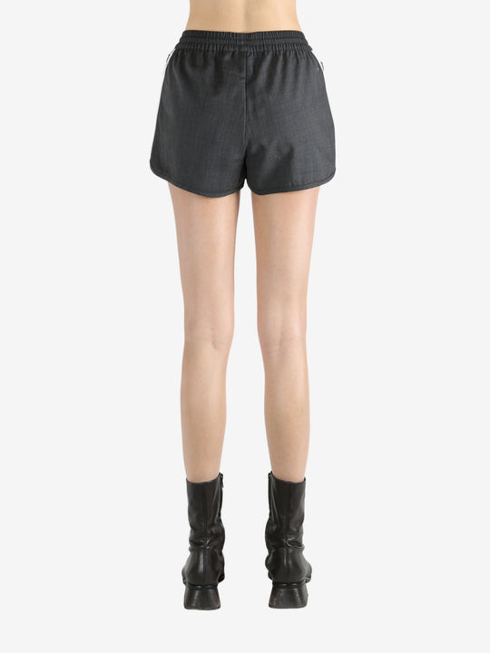 Black shorts worn by a person, showing the shorts's fit