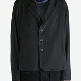 Black jacket worn by a person, showing the jacket's fit