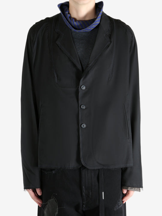 Black jacket worn by a person, showing the jacket's fit