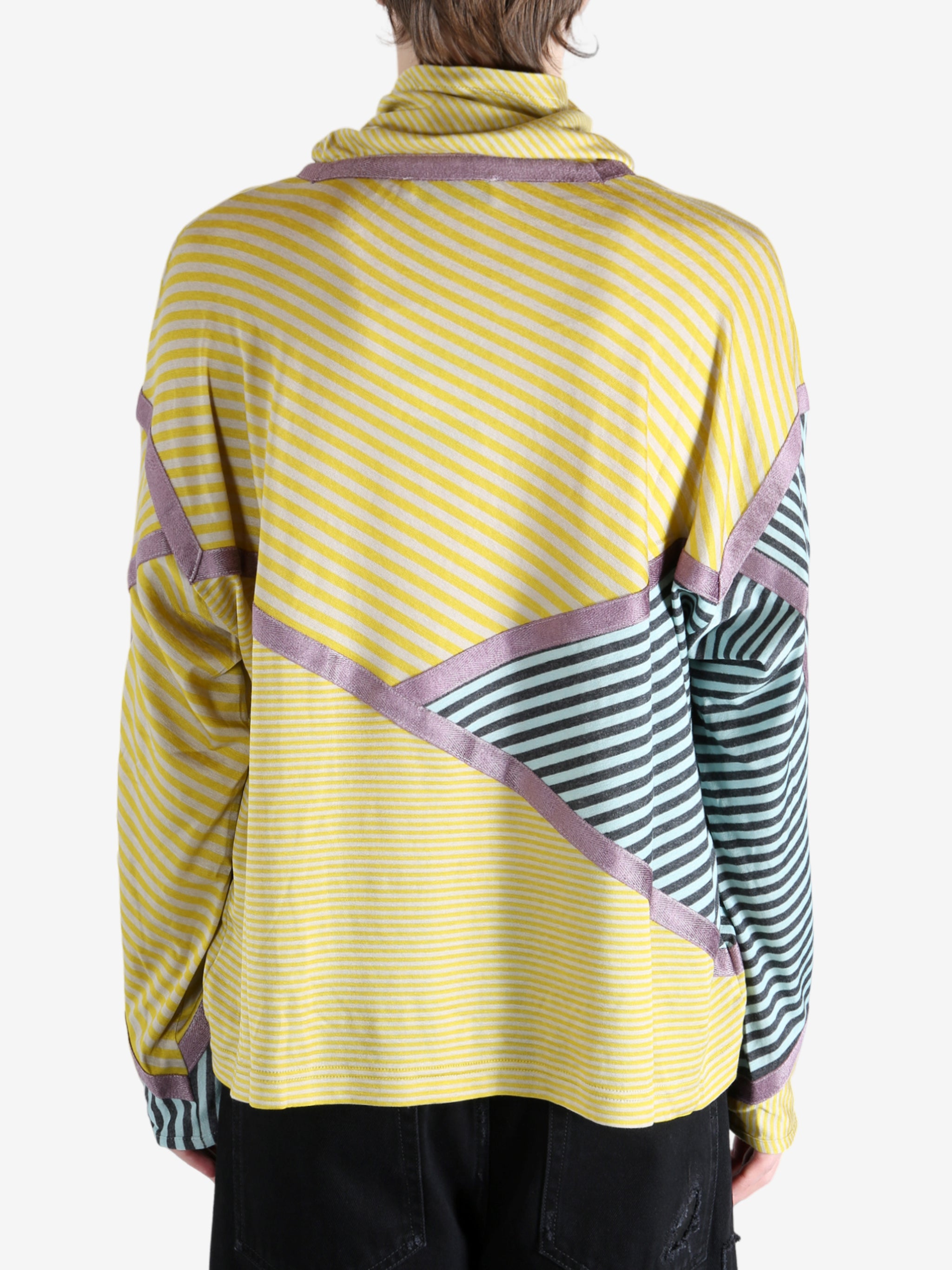 Yellow top worn by a person, showing the top's fit