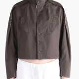 Brown jacket worn by a person, showing the jacket fit