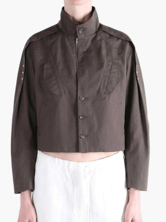 Brown jacket worn by a person, showing the jacket fit